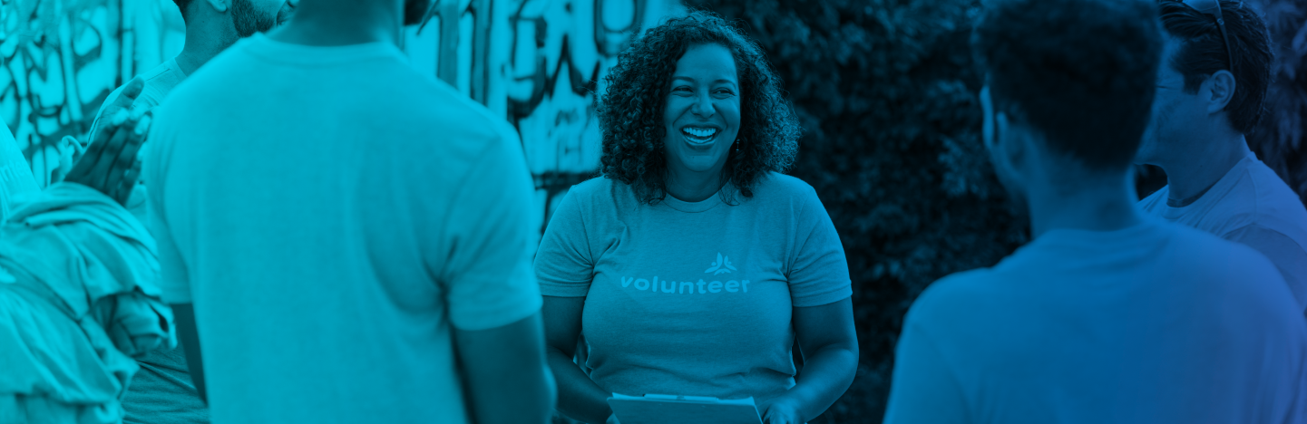 Volunteer interacting with community members