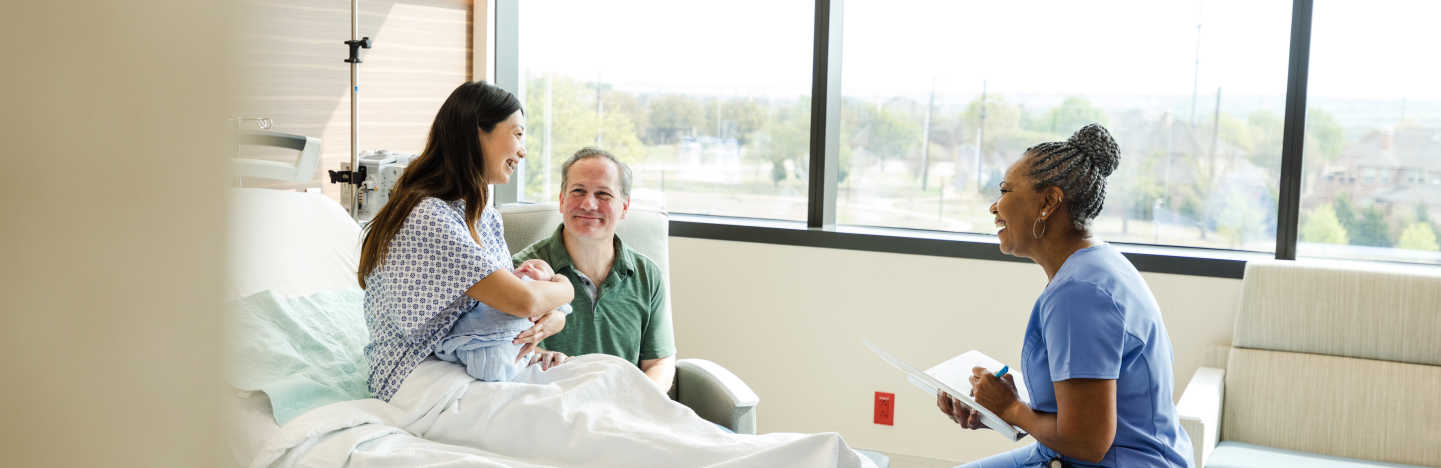 Nurse meeting with new family