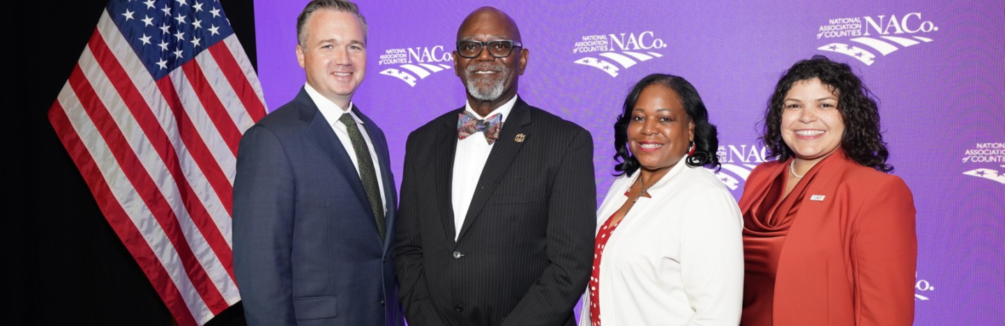NACo's 2026-2027 officers gather following the 2026 Annual Business Meeting during the Annual Conference in Orleans Parish, La. From left: Immediate Past President J.D. Clark, President George Dunlap, First Vice President Alisha Bell and Second Vice President Sarah Benatar. Photo by Denny Henry