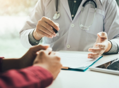 Doctor talking to the patient about menopause and treatment in future