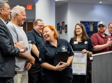 Kathleen Cramer (center) celebrates a county resolution honoring Manatee County Stand Down. Photo courtesy of Manatee County