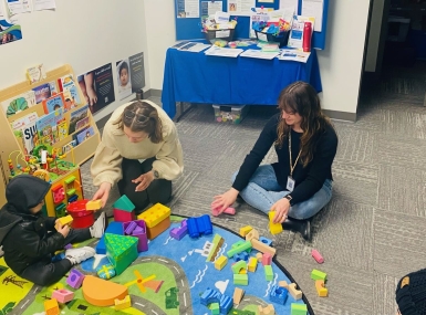 Family Resource Center staff and volunteers engage children while parents utilize resource navigation services. Photo courtesy of Suzanne Arntson