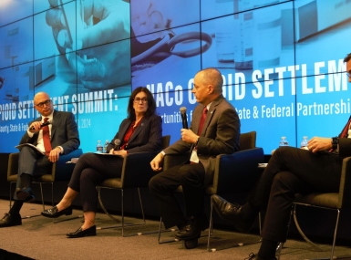 Tony McDowell (right), executive director, Virginia Opioid Abatement Authority, speaks to Stephen Acquario, executive director, New York State Association of Counties and Gina Nikkel, executive director, Association of Oregon Counties Jan. 10 in Washington, D.C.  Photo by Charlie Ban