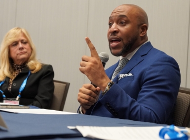 Aaron Myers, executive director, D.C. Commission on the Arts and Humanities, speaks Saturday to members of the NACo Arts & Culture Commission. To his right is Montgomery County, Ohio Commissioner Debbie Lieberman.  Photo by Leon Lawrence III