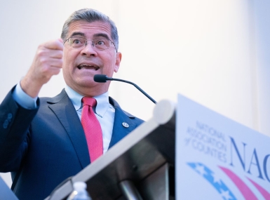 HHS Sec. Xavier Becerra makes a point Sunday while speaking to members of NACo’s Large Urban County Caucus at the NACo Legislative Conference. Photo by Denny Henry