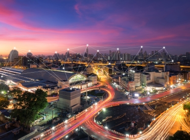 View of city with points of connected lights