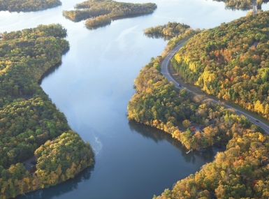 Curving road along Mississippi River during autumn