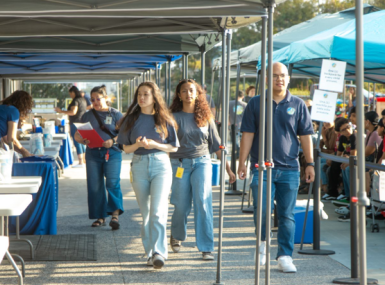 San Diego County’s Child Support Services student workers help staff at an outreach event for the department.