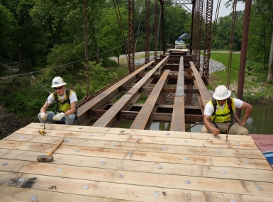 Workers reassemble restored pieces of the Old River Bridge May 14 in Saline County, Ark. Photo courtesy of Trevor Villines