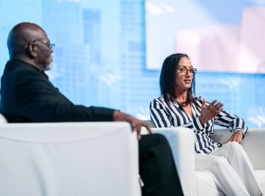 Leslie Boissiere, of the Annie E. Casey Foundation, talks about her organization’s support of youth-centered services with Second Vice President George Dunlap during the Closing General Session July 13. Photo by Denny Henry