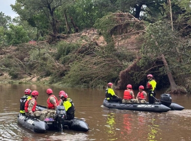 Texas National Guard troops use boats to search for survivors in Kerr County following floods that began in the region on July 4, 2025. More than 230 Guard personnel are working in three counties to clear debris and conduct search and rescue operations. Photo courtesy of the Texas National Guard