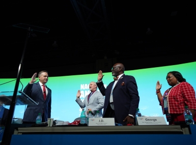 NACo President JD Clark swears in Immediate Past President James Gore, First Vice President George Dunlap and Second Vice President Alisha Bell. Photo by Denny Henry