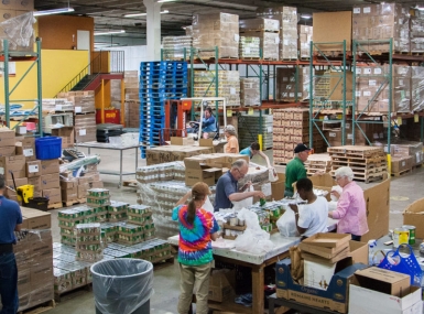 Workers sort meals at the Larimer County, Colo. Food Bank.