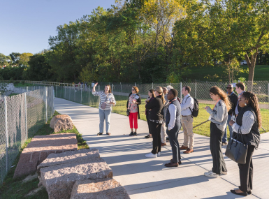 Large Urban County Caucus (LUCC) members and NACo staff tour South Shore Park’s new beach Oct. 8. It opened to the public in August in Milwaukee County, Wis. Photo by Front Room Studios