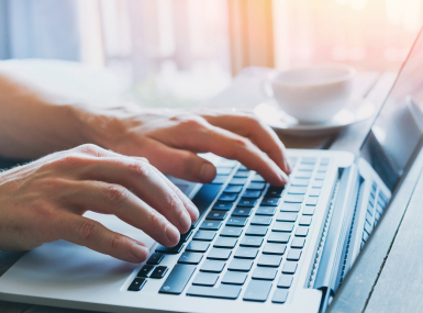 close up of hands of business person working on computer, man using internet and social media