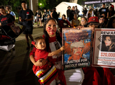 Bernadette Smith attends the vigil in honor of her sister Nicole, who was murdered in 2017. 