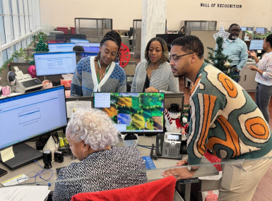 Staff members from different generations collaborate on a project in the Dallas County, Texas clerk's office. Photo courtesy of the Dallas County Clerk's Office