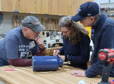 Volunteers work together at a Fix-It Fair. Photo courtesy of Rob Pudner