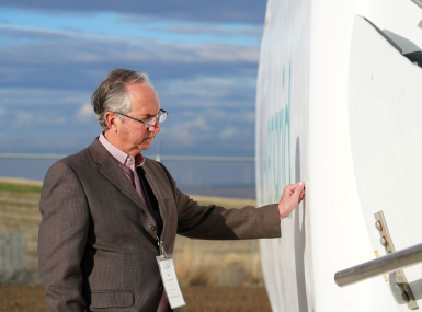 Carson County, Texas Judge Dan Looten gets hands-on with a wind turbine at the Avangrid National Training Center — his first time touching one, despite more than 700 turbines in the county. Photo by Charlie Ban