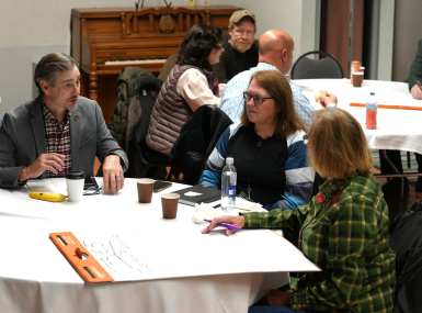 Dickenson County, Va. Supervisor Chris Hall, Story County, Iowa Planning and Development Director Leanne Harter and Crook County, Ore. Commissioner Susan Hermreck discuss parameters for regulation of local energy projects during the December 2025 NACo Rural Energy Academy. Photo by Charlie Ban 