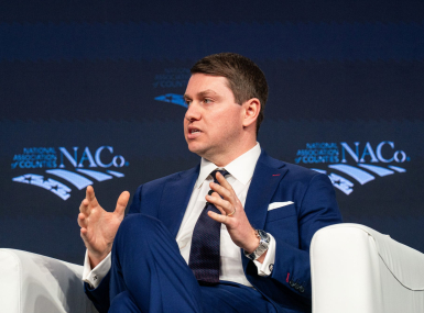 Alex Meyer, assistant to the president and director of the  White House Office of Intergovernmental Affairs, speaks Feb. 24 with NACo President J.D. Clark to a General Session crowd.  Photo by Denny Henry