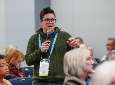 V. Fixmr-Oraiz, a Johnson County, Iowa county supervisor, asks a question during the workshop on H.R. 1. Photo by Leon Lawrence III