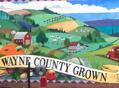 A mural on the wall of the Here and Now Brewing Company in Honesdale celebrates Wayne County, Pa.’s agricultural community.