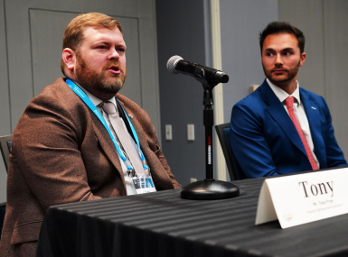 Tony Frye (left) discusses Federal Highway Administration priorities. Photo by Denny Henry