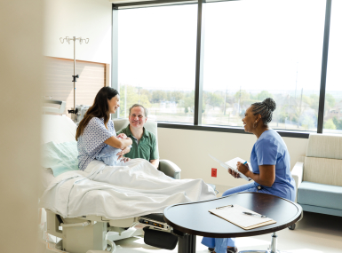 Nurse meeting with new family