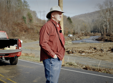 Avery County, N.C. Commissioner Dennis Aldridge surveys damage from Hurricane Helene in 2024 in this still from the North Carolina Association of County Commissioners’ documentary, “Rising Above Helene,” directed by Chris Baucom of 100 Strong Productions. 