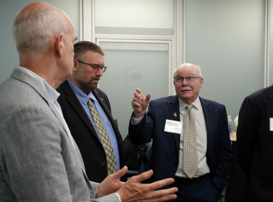 Converse County, Wyo. Commissioner Jim Willox (right) talks to Rep. Rick Larsen (D-Wash.) about the BUILD America 250 Act. Photo by Charlie Ban