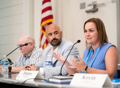 Danny DeHoog, deputy director of Government Relations, Maricopa County, Ariz., discusses state and federal policy impacts with fellow panelists Shawnee County, Kan. Commissioner Aaron Mays (to her immediate right) and Converse County, Wyo. Commissioner Jim Willox. Photo by Denny Henry