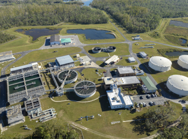 Modern water cleaning facility at urban wastewater treatment plant. Purification process of removing undesirable chemicals, suspended solids and gases from contaminated liquid - Stock Photo