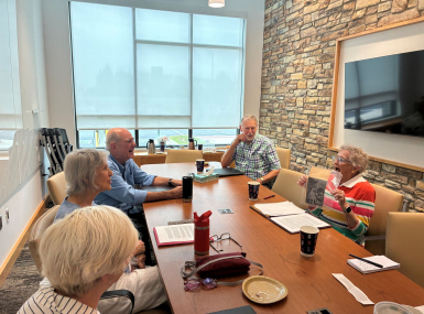 Memoir group participants exchange stories about their childhoods at a Loudoun County, Va. library.  Photo by Meredith Moran