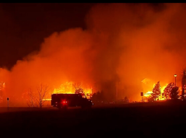 Flames engulf homes in the Marshall Fire, Dec. 30, 2021. Photo by NOAA Boulder