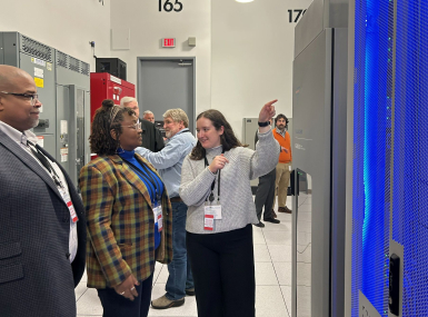 NACo Associate Legislative Director Emma Conover shows Wake County, N.C. Commissioner Shinica Thomas and her husband, Raymond, the inside of a server rack at a Digital Realty data center in Loudoun County, Va., in October 2025. Photo by Charlie Ban