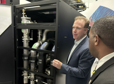 An associate with Digital Realty shows county officials the cooling system in one of its Loudoun County, Va. data centers in October 2024. Photo by Charlie Ban