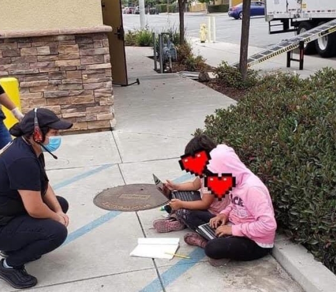 Two Monterey County, Calif. students use Wi-Fi from a Taco Bell restaurant in East Salinas to do their schoolwork in August 2020. Photo courtesy of Monterey County