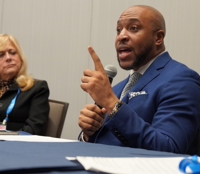 Aaron Myers, executive director, D.C. Commission on the Arts and Humanities, speaks Saturday to members of the NACo Arts & Culture Commission. To his right is Montgomery County, Ohio Commissioner Debbie Lieberman.  Photo by Leon Lawrence III