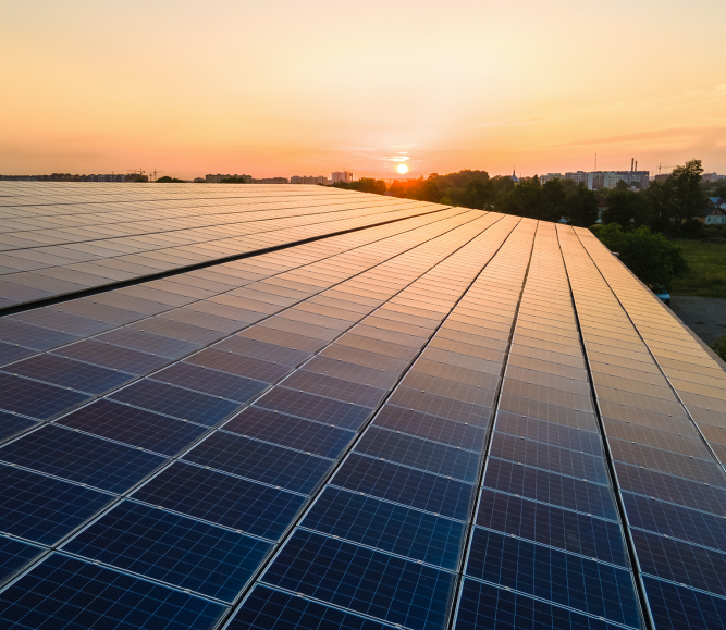 Blue photovoltaic solar panels mounted on building roof