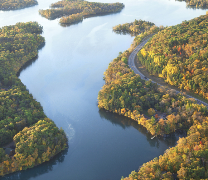Curving road along Mississippi River during autumn