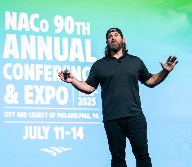 Former NFL player and magician Jon Dorenbos, mesmerizes the  General Session crowd Sunday, July 13 with his magic and life story. Photo by Denny Henry