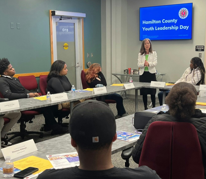 Hamilton County, Ohio high school government students hear a presentation on county government from County Commissioners Reece and Driehaus.