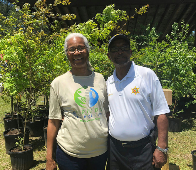 Residents participate in outdoor festivities during a county-wide NCGM and Earth Day celebration at a community park in Mobile County, Ala.