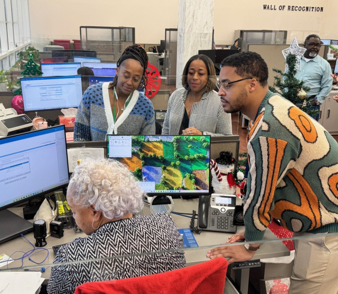 Staff members from different generations collaborate on a project in the Dallas County, Texas clerk's office. Photo courtesy of the Dallas County Clerk's Office