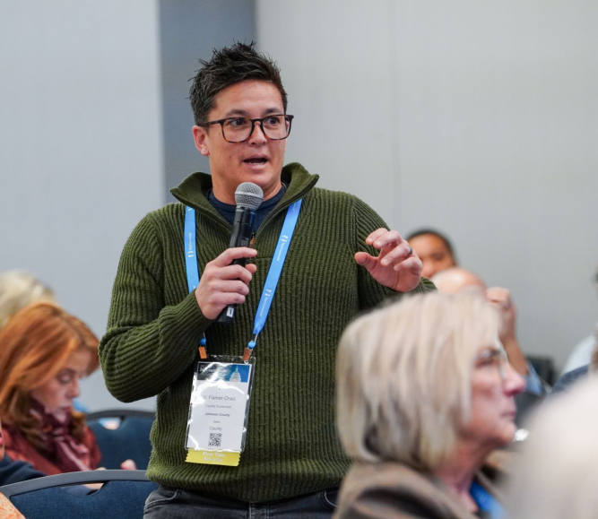 V. Fixmr-Oraiz, a Johnson County, Iowa county supervisor, asks a question during the workshop on H.R. 1. Photo by Leon Lawrence III