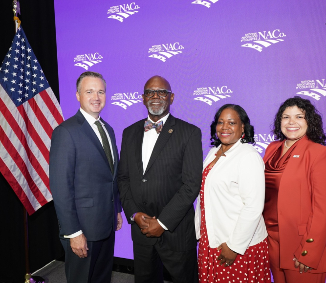 NACo's 2026-2027 officers gather following the 2026 Annual Business Meeting during the Annual Conference in Orleans Parish, La. From left: Immediate Past President J.D. Clark, President George Dunlap, First Vice President Alisha Bell and Second Vice President Sarah Benatar. Photo by Denny Henry