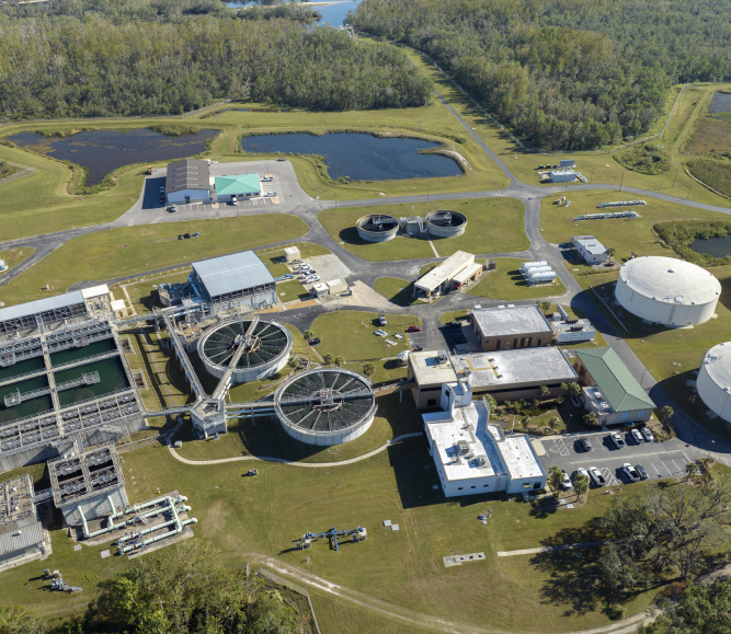 Modern water cleaning facility at urban wastewater treatment plant. Purification process of removing undesirable chemicals, suspended solids and gases from contaminated liquid - Stock Photo