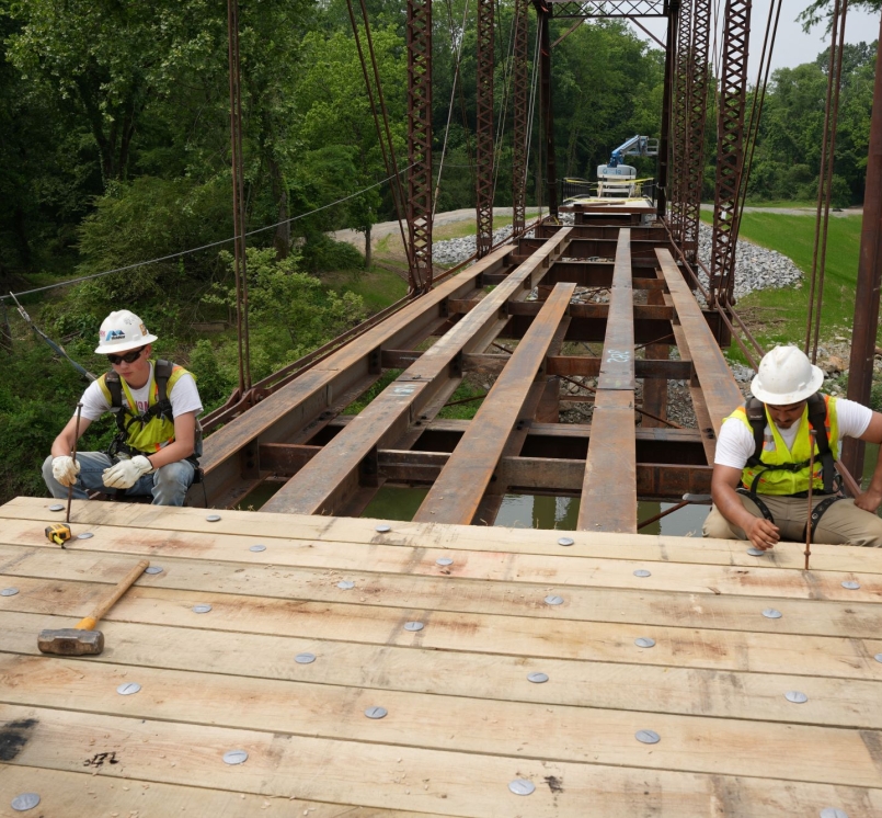 Workers reassemble restored pieces of the Old River Bridge May 14 in Saline County, Ark. Photo courtesy of Trevor Villines
