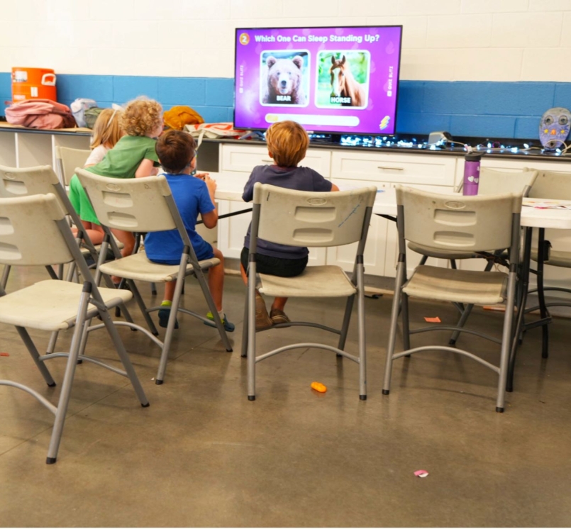 Children play an educational game in the library at the South Philadelphia Community Health and Literacy Center. Photo by Leon Lawrence III